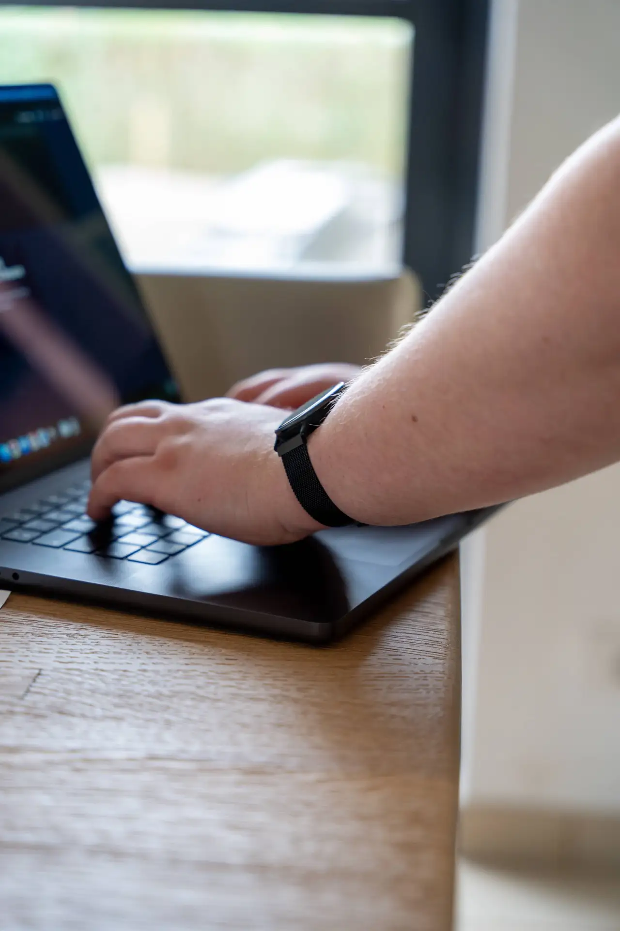 Typing on laptop